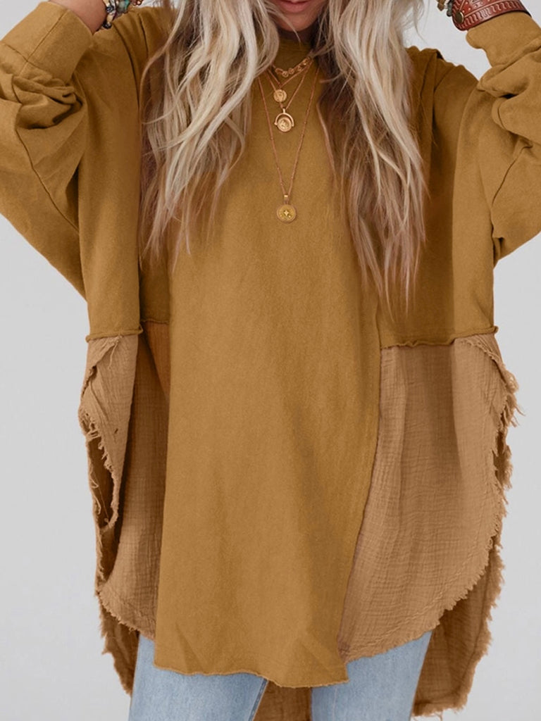 Camel Colour high-low tunic length split hem pullover, features a round neckline and long sleeves, blend of crinkled gauze and knit, and raw edge design.