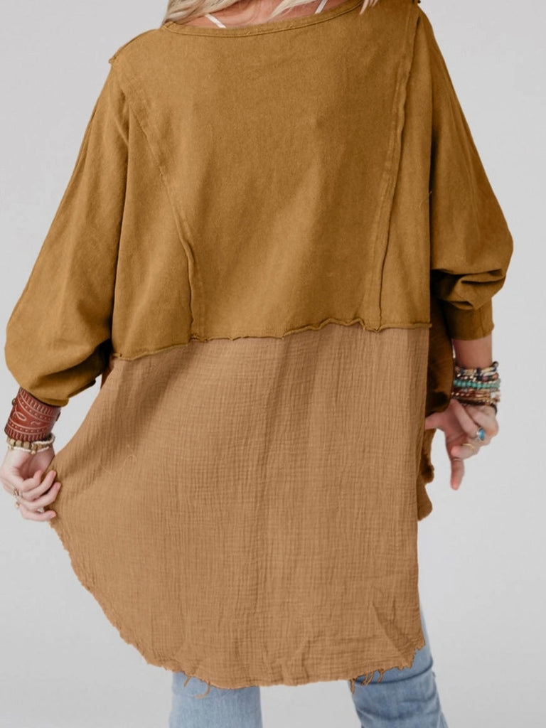 Camel Colour high-low tunic length and split hem pullover, features a round neckline and long sleeves, blend of crinkled gauze and knit, and raw edge design.