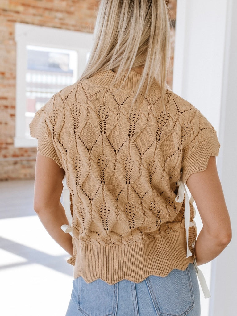 Khaki sweater with unique scalloped design and lace-up sides. Short sleeved.