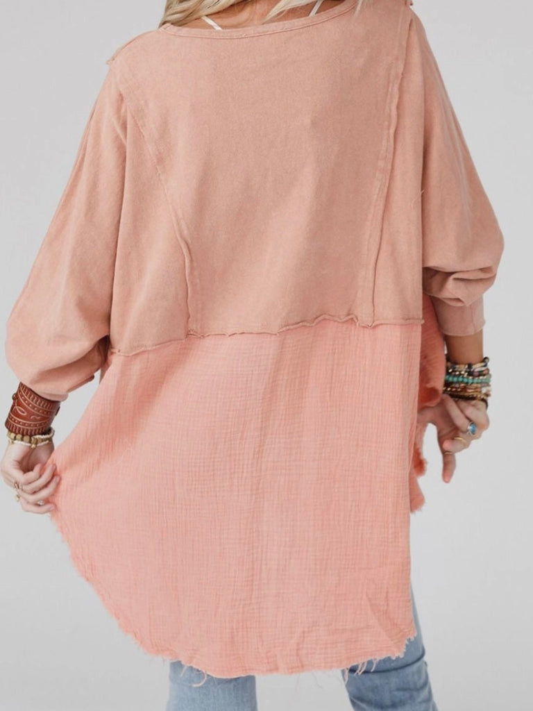 Pink Colour high-low tunic length and split hem pullover, features a round neckline and long sleeves, blend of crinkled gauze and knit, and raw edge design.