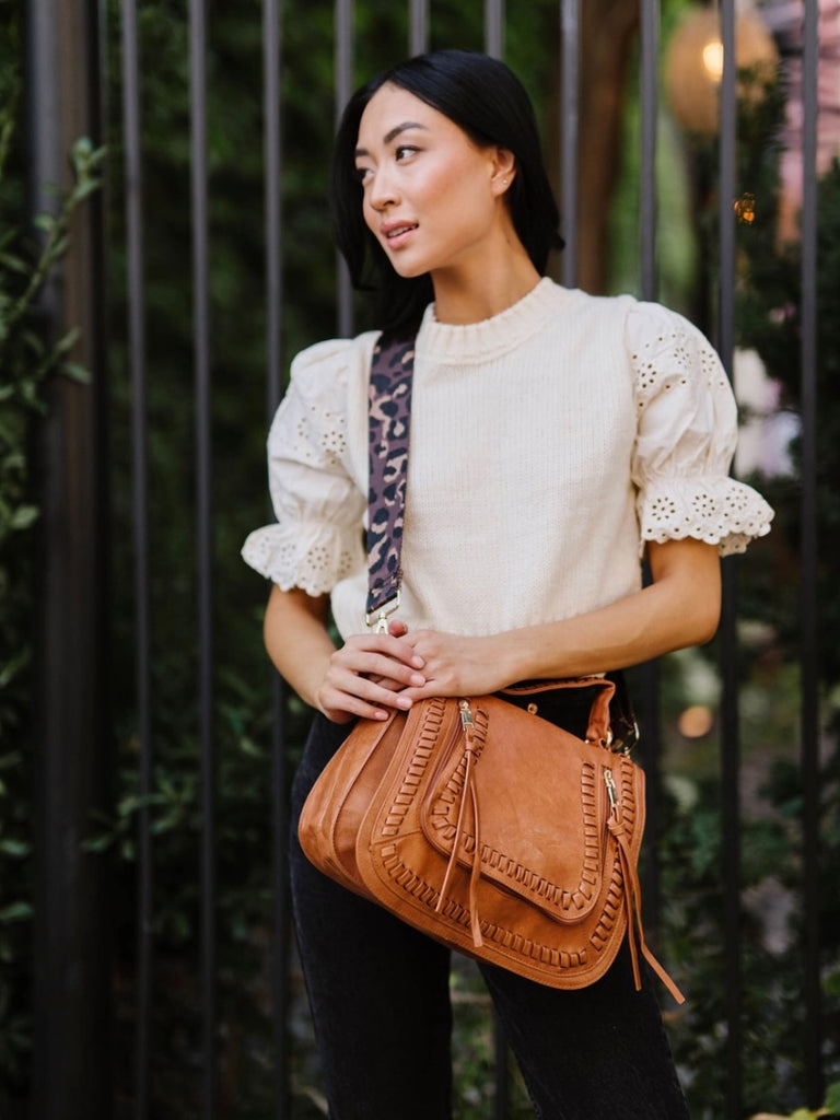 Leopard Adjustable Strap, brown vegan purse with 2 Zippered pockets and Gold Hardware.