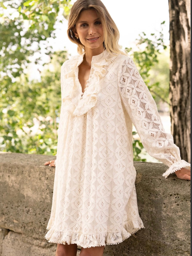 Cream Lace Midi Dress featuring a frilly collar and buttons, long ruffle sleeves, and a flared cut with ruffle details at the bottom.