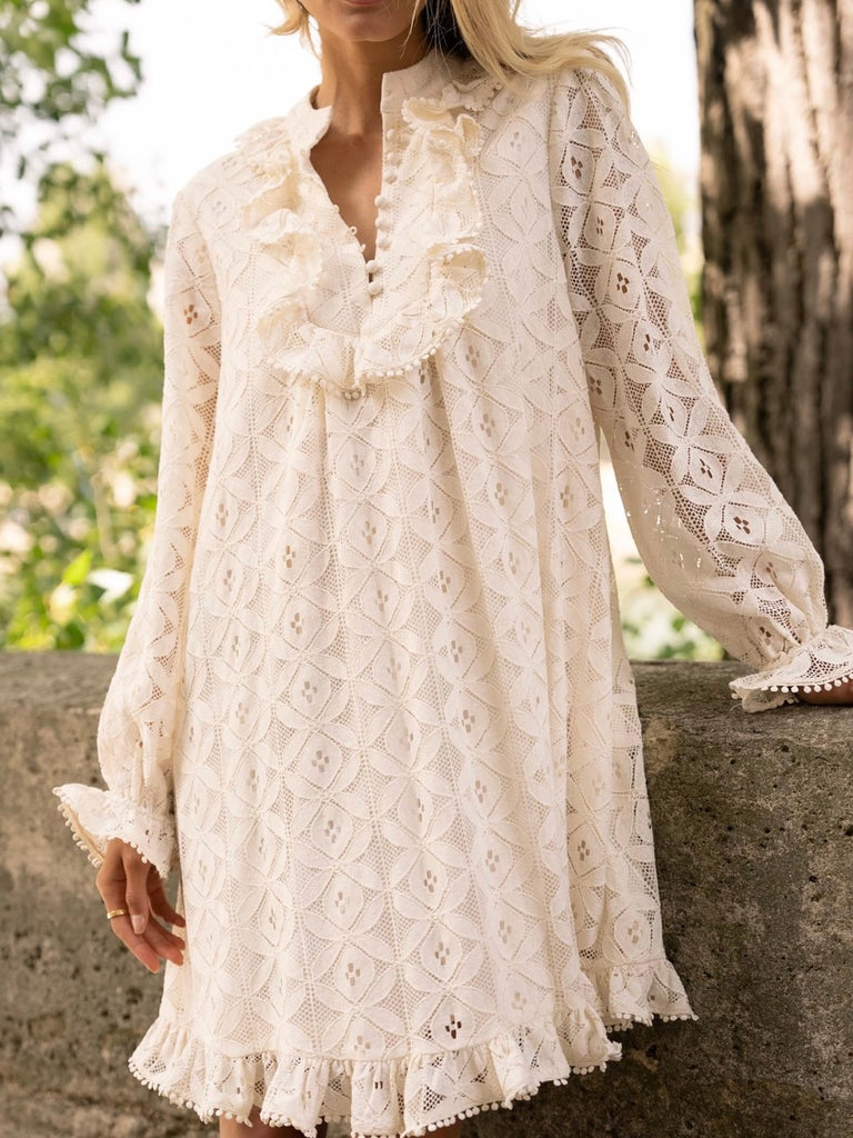 Cream Lace Midi Dress featuring a frilly collar and buttons, long ruffle sleeves, and a flared cut with ruffle details at the bottom.