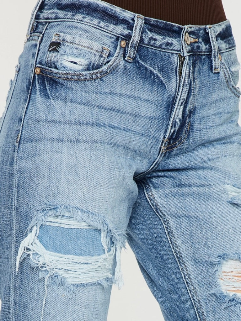 High Waisted ,5 Pocket Single Button Front and zip-fly Jean, with Light Fading and 3d Whisker detail , and moderate destruction with patches on both legs .