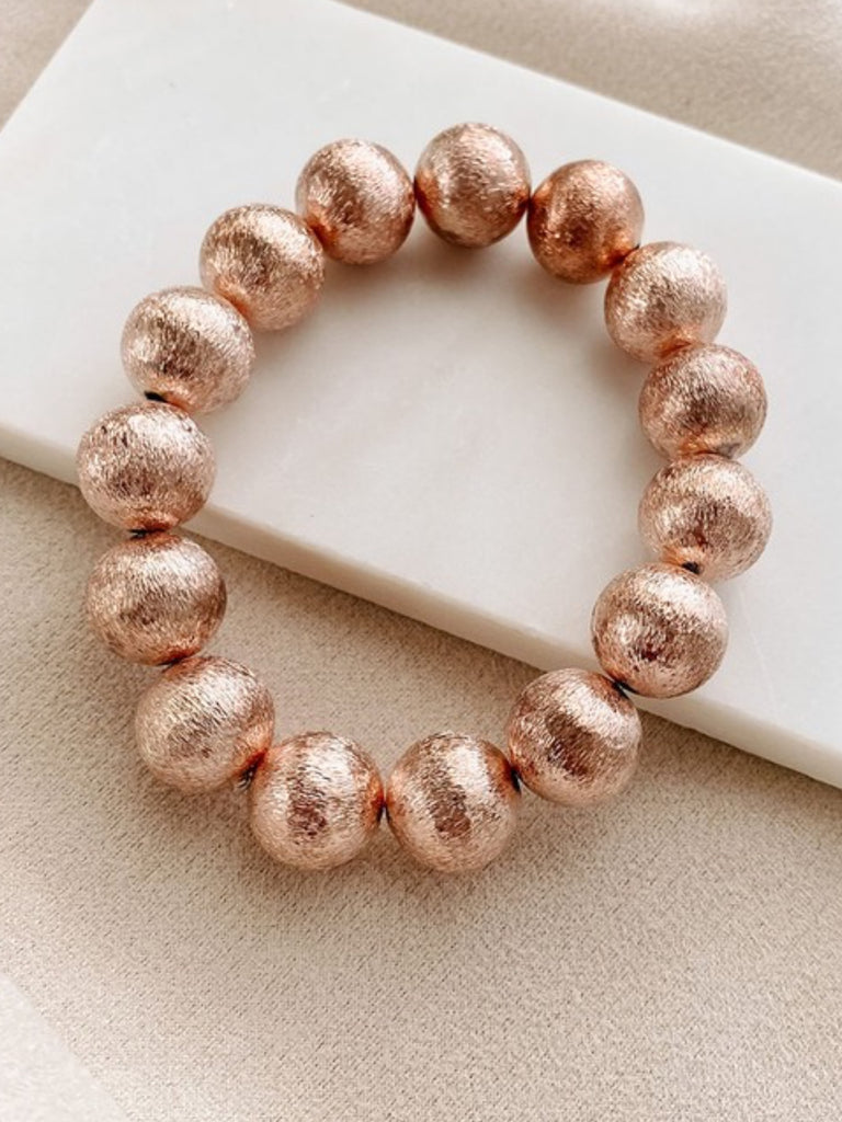 Rose Gold Oversized Bead Bracelet made of iron, brass and wood has adjustable closure for the perfect fit.