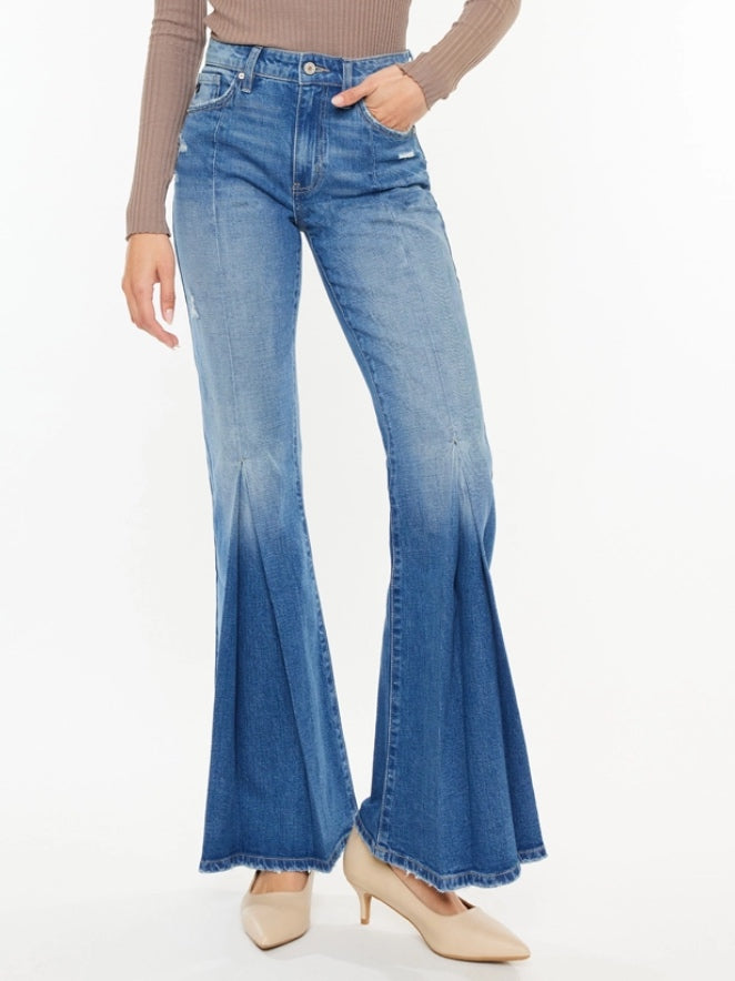 High Rise Flare Jeans with wide leg pleats detail and 5 pocket style, single-button closure, and zip fly.