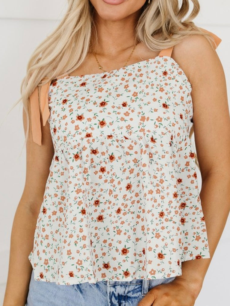 Orange small floral print Tank Top, has a tied shoulder and multiple ties in the back.