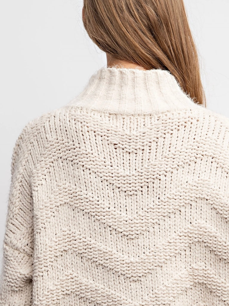 Beige Chevron Sweater ,with stretch and medium weight yarn, has a loose fit and drop shoulder design with ribbed bands.