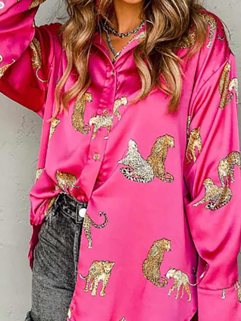 Pink button up leopard print blouse. Long sleeves. 100% polyester.