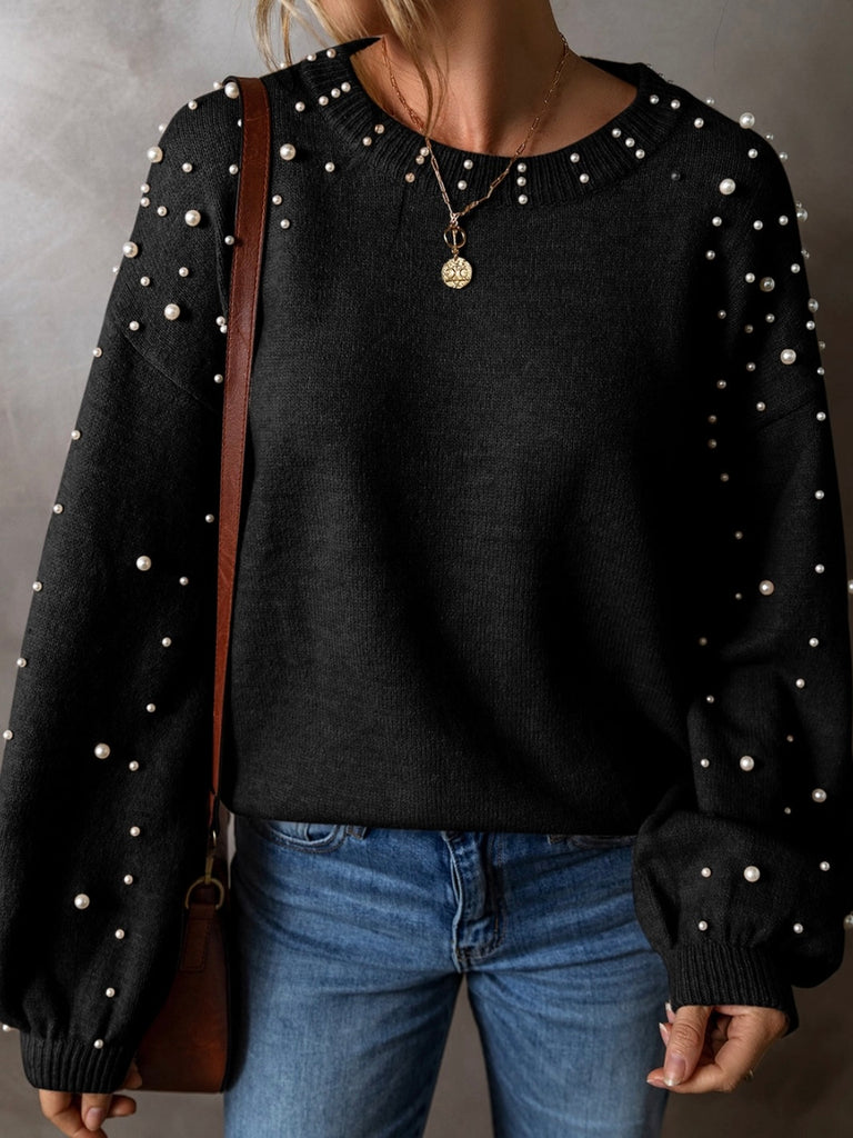 Black colour sweater with white pearls throughout, with a drop shoulder design and classic round neck .