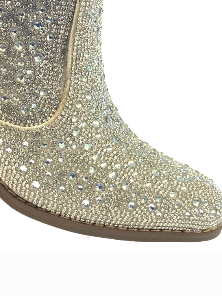 Silver western-style booties are adorned with dazzling rhinestones.