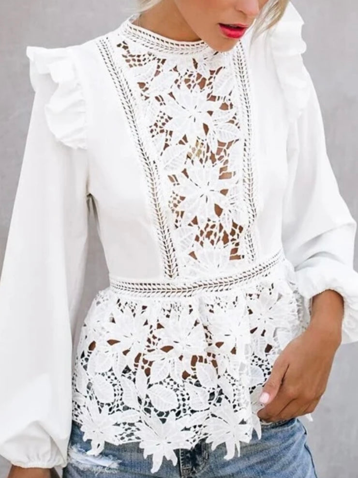 Lace Blouse in White, with ruffled shoulders and neckline and has intricate lace details .