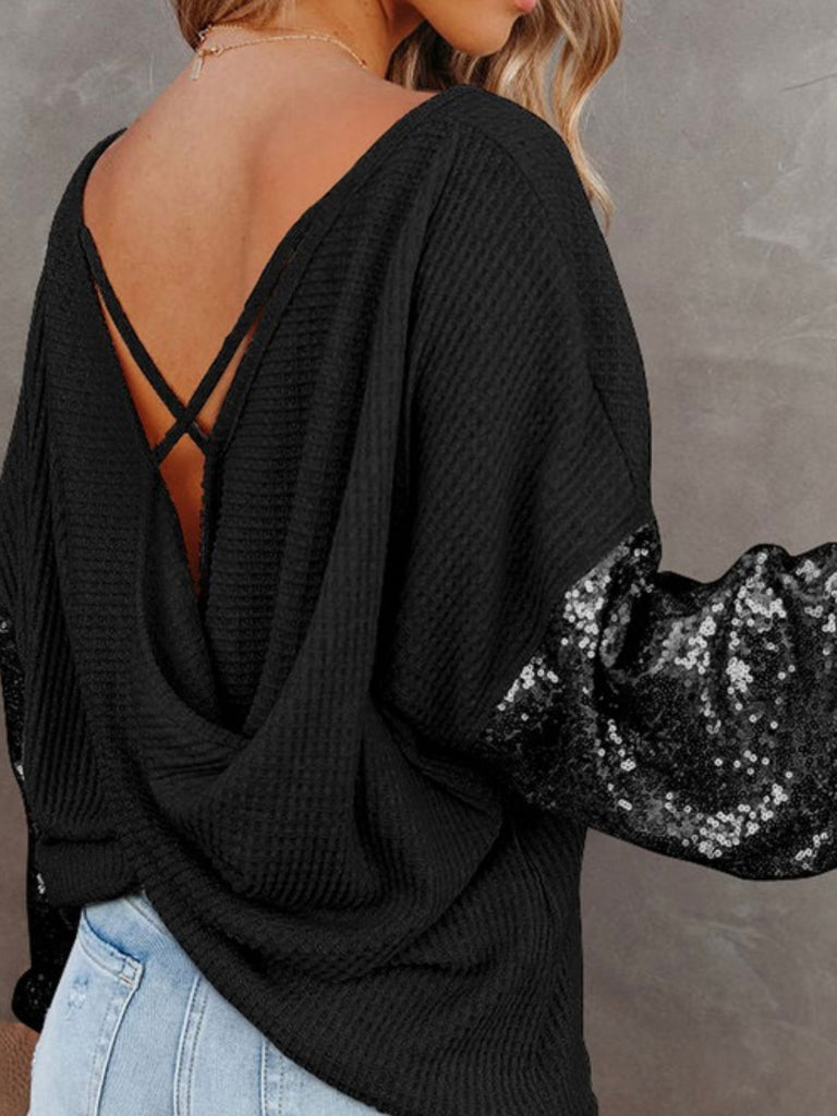 Black Sequin Sleeves Top with soft waffle knit fabric, and adjustable open-back tie detail.