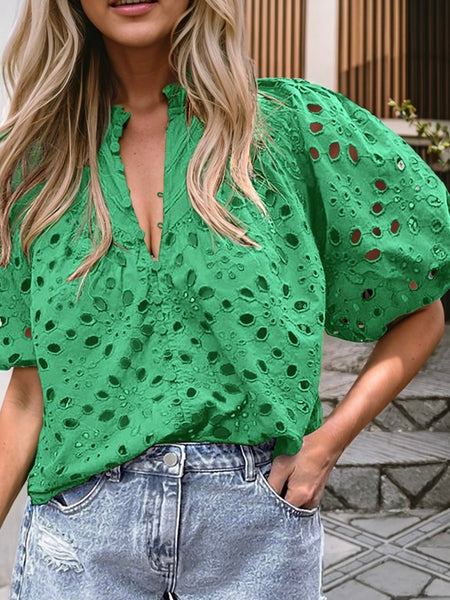 Green Hollowed Eyelet Blouse with delicate flower embroidery, puff sleeves and buttoned neckline. 