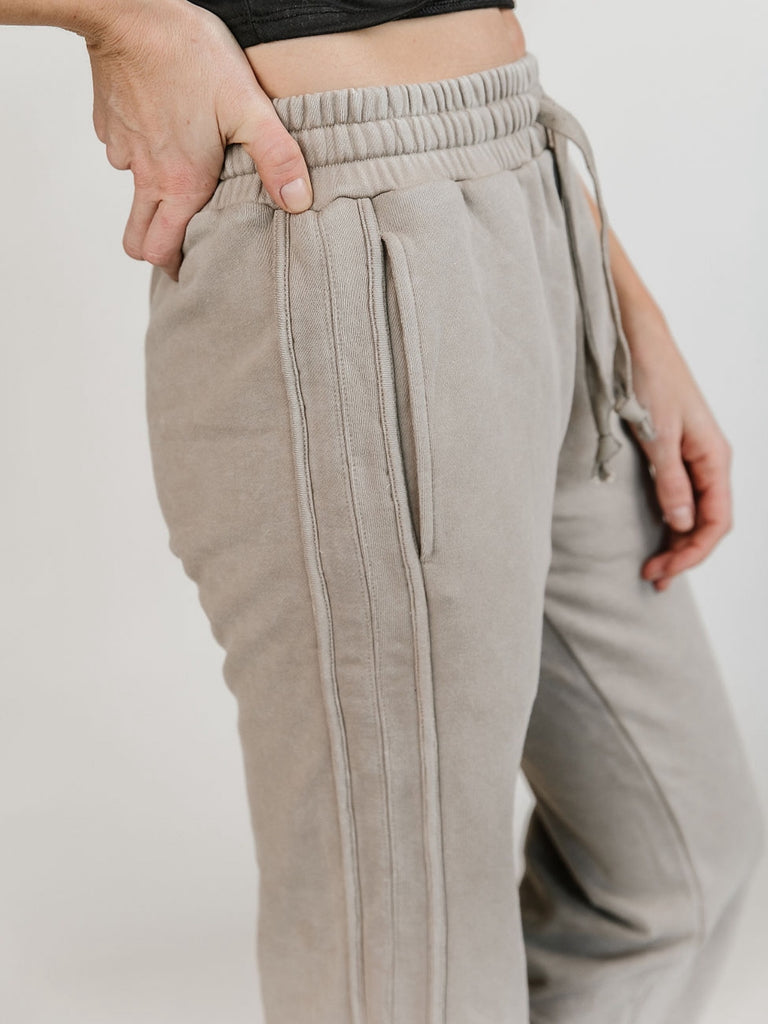 Medium Stretch Stone -Grey elastic-waisted, straight-legged pant with two side pocket and hem slits, and tie waist.