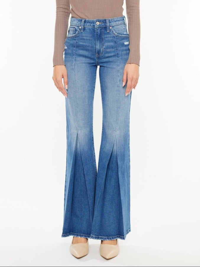 High Rise Flare Jeans with wide leg pleats detail and 5 pocket style, single-button closure, and zip fly.