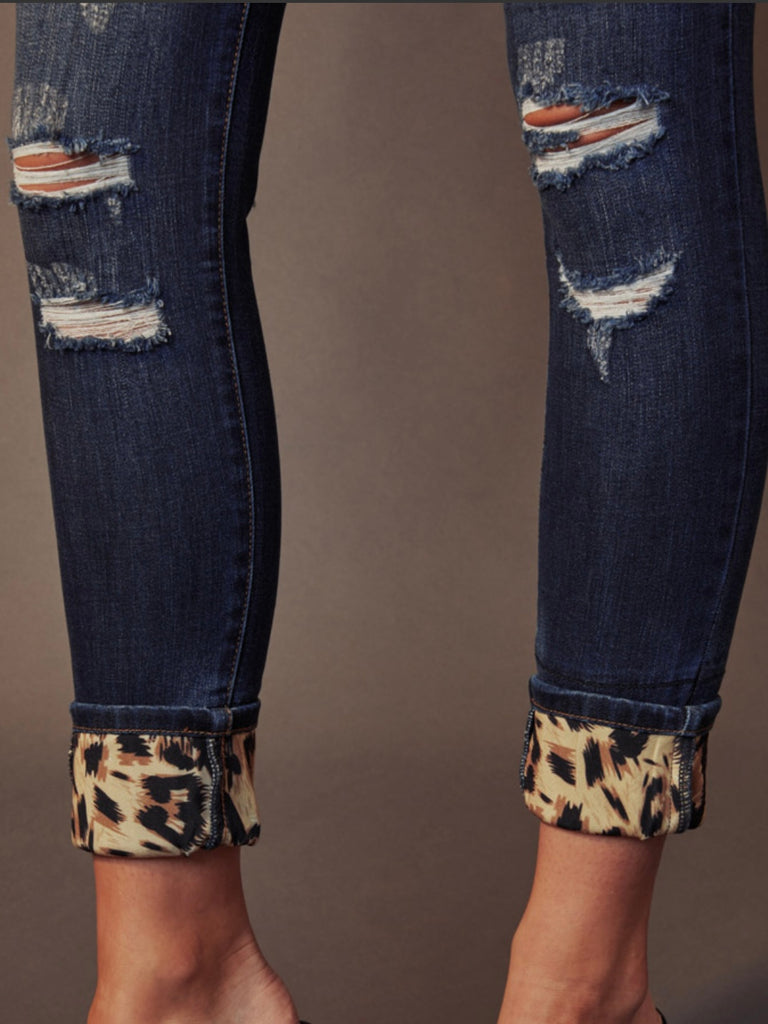 Distressed Leopard Jeans by Kancan with uniquely defined leopard print bottom hem.