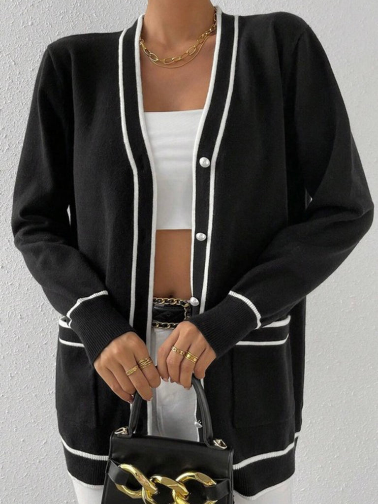 Button Front Varsity Cardigan in black with white trim and a longer fit, with front pockets.