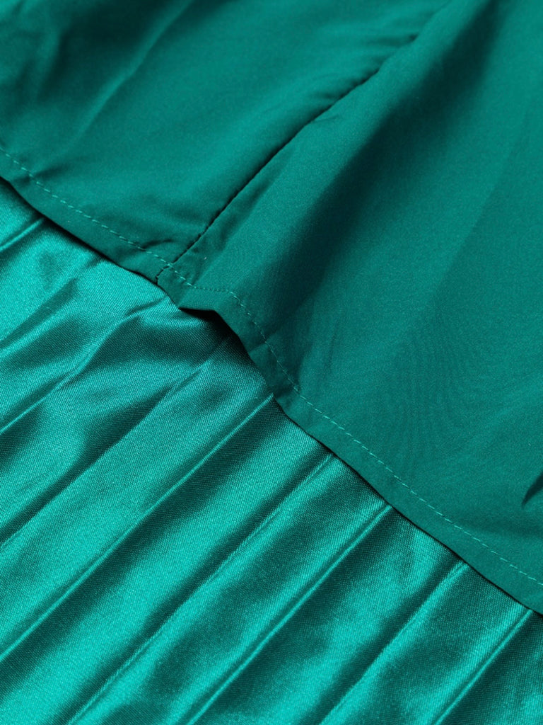 Emerald green satin pleated skirt. High waisted elastic waist band. Lightly lined.