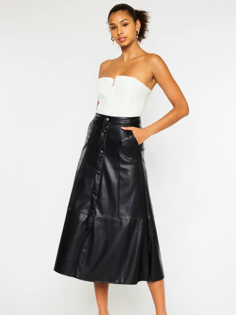 Black Faux -Leather Skirt features a high waistline, Exposed Snap Button Closure, the length of the skirt falls to the floor, and has handy pockets.