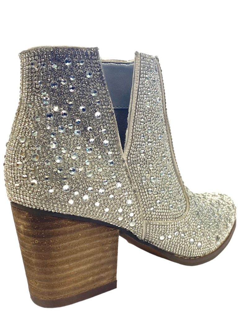 Silver western-style booties are adorned with dazzling rhinestones.