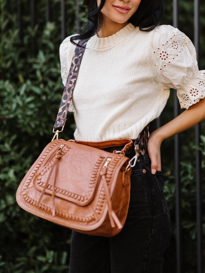 Brown Vegan Leather Purse with Leopard adjustable strap , 2 zippered front pockets and gold hardware.