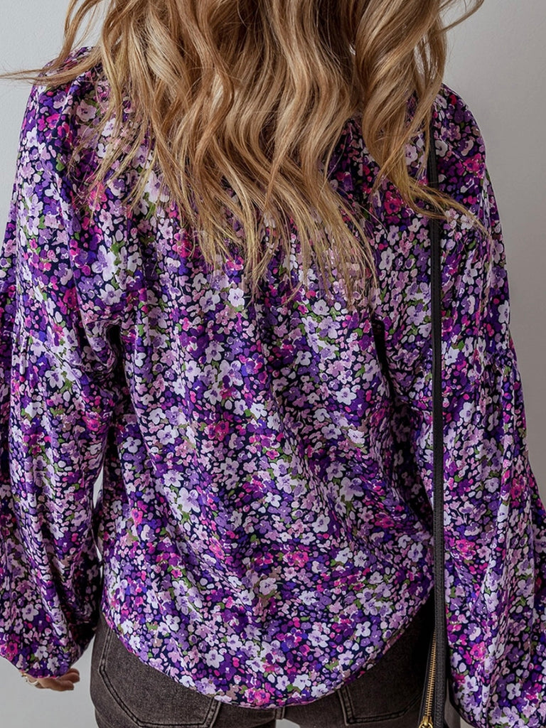  Boho-inspired blouse features a trendy tie front and beautiful floral print with bubble sleeves.