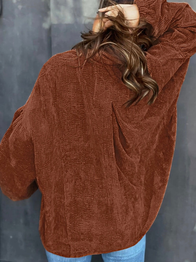 Brown Corduroy Shacket features a trendy oversized fit, with puff sleeves and a pleated back and button front.