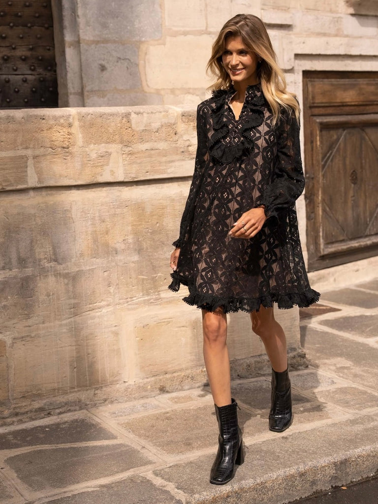 Black Lace Midi Dress featuring a frilly collar and buttons, long ruffle sleeves, and a flared cut with ruffle details at the bottom.