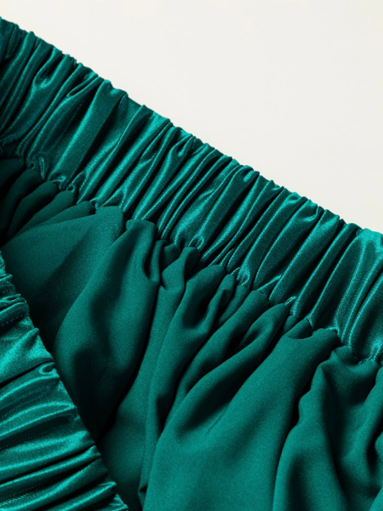 Emerald green satin pleated skirt. High waisted elastic waist band. Lightly lined.