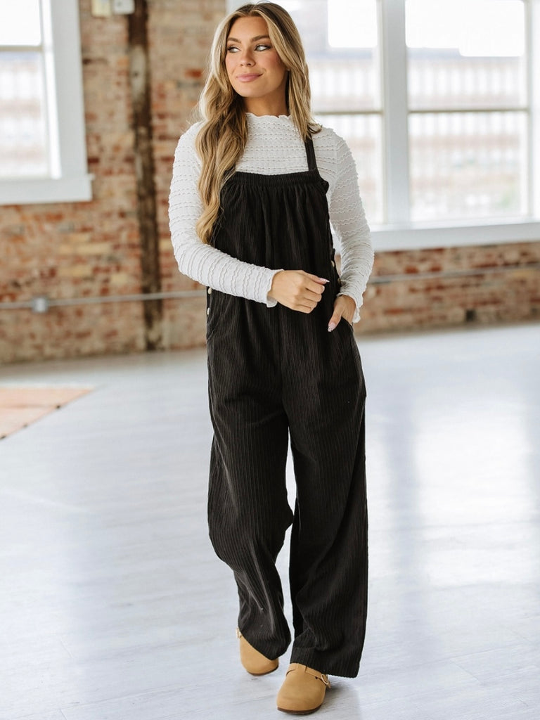 Black, loose fit vintage-inspired corduroy Overalls with Multi-pocket design for added functionalit