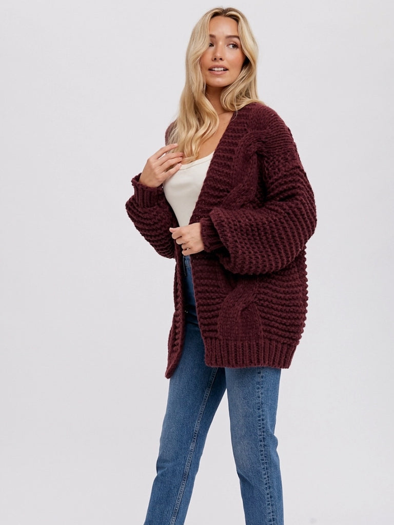 Wine Colour Chunky Cable Cardigan with long batwing sleeves and unique braid pattern, it's an oversize fit.