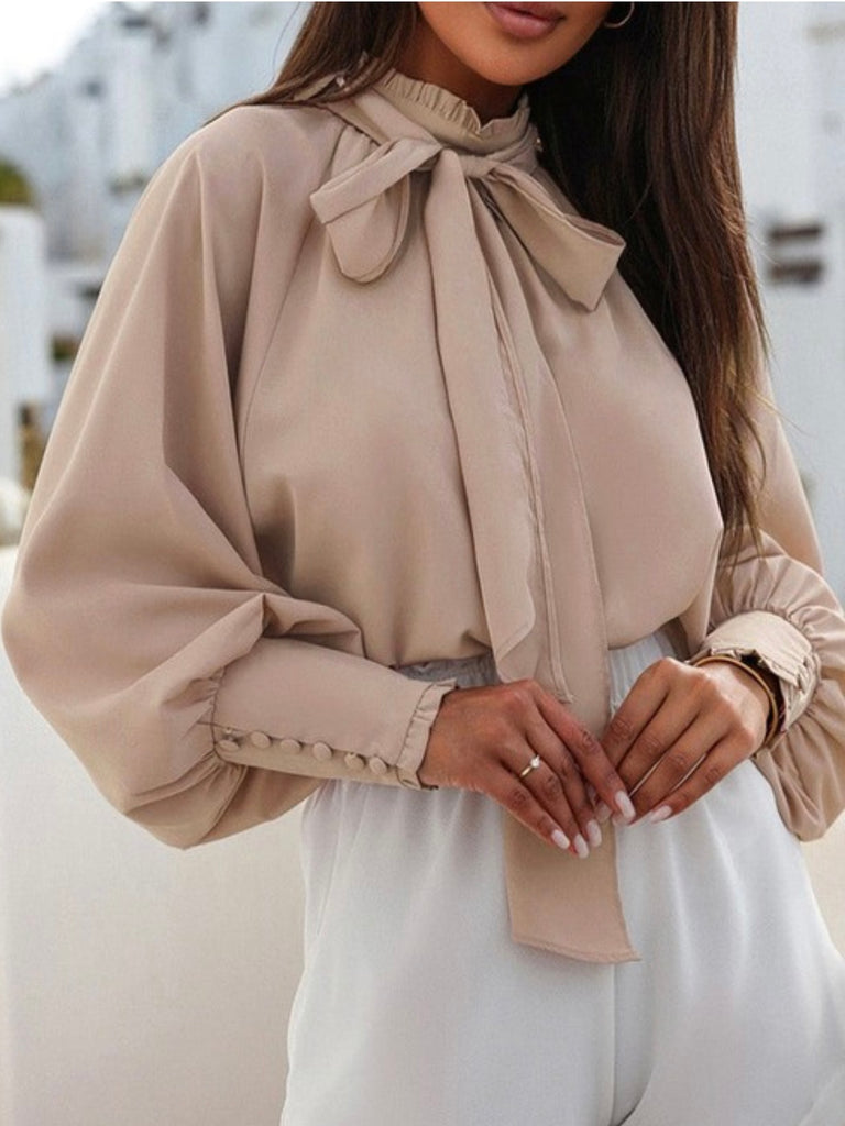 Khaki Brown, loose fit ,Mock neck with Bishop sleeves ,and frilled, buttoned cuffs with  a Self-tie bow for a feminine touch.