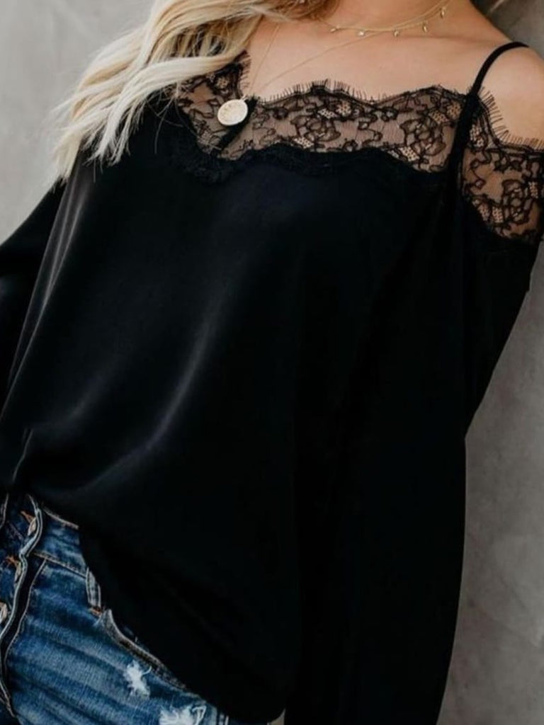 Black long Sleeve Top featuring dainty lace accents on the wrists and neckline, along with spaghetti straps, and a plunging back.