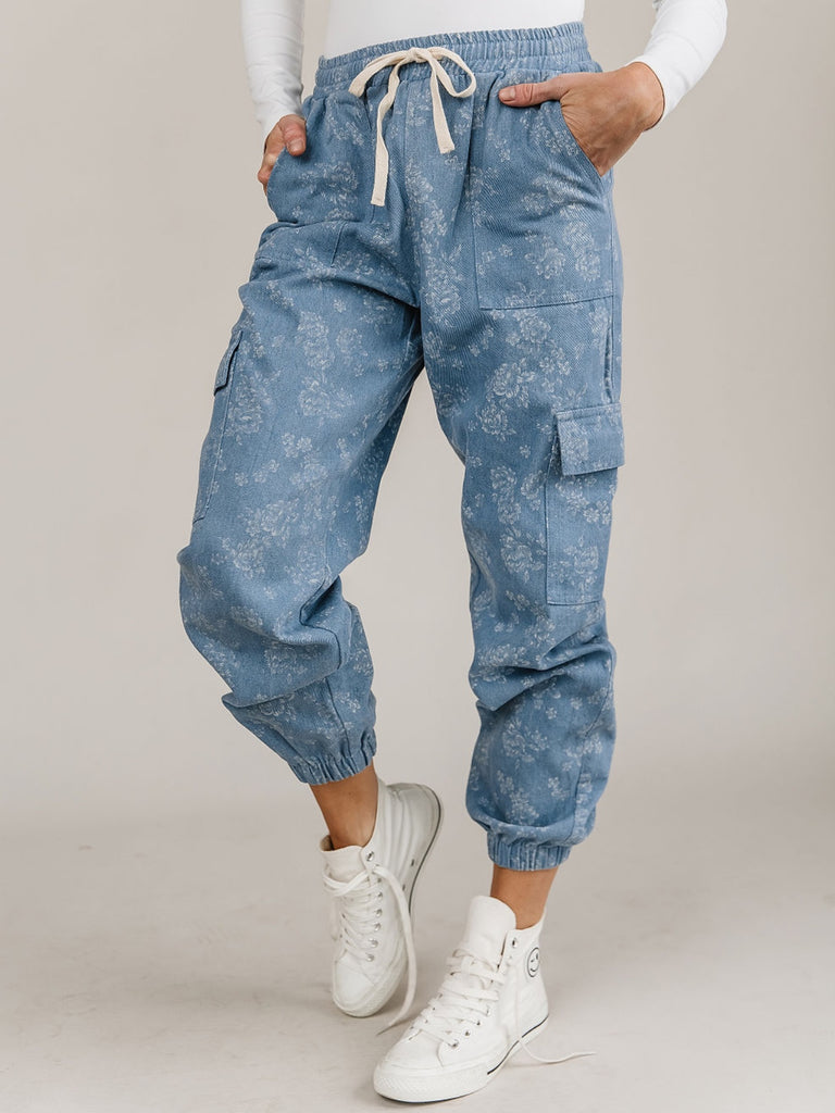 Denim Joggers, features include : a drawstring waist, curved elastic ankle and light-wash denim, with a spring-fresh, white floral print.