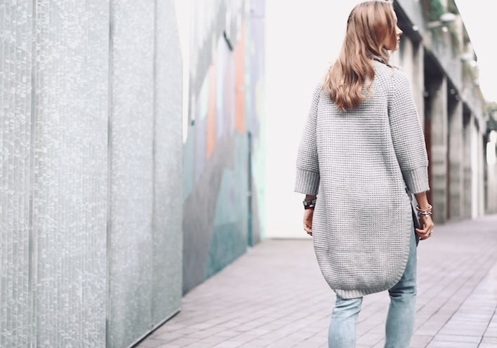 Dove Grey Sweater with Ribbed hemming detail and a side -slit for a comfy , loose-fit look. Features a  turtle neck and thermos textured knitting.