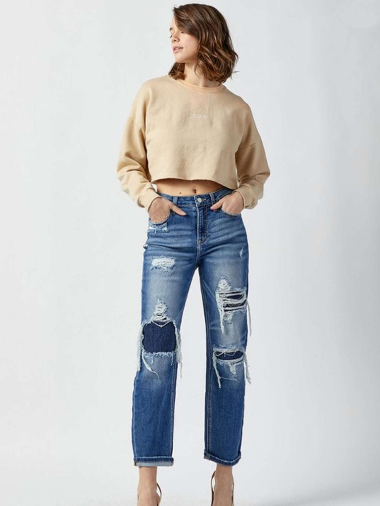 Distressed Straight Leg Jeans with cropped length and covered patches with a touch of light whisking throughout.