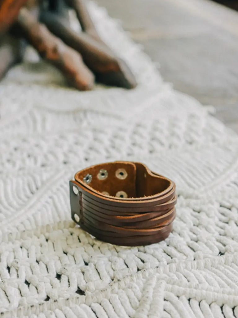  Brown , 100% leather, adjustable clasps and a snap close Boho Bracelet.