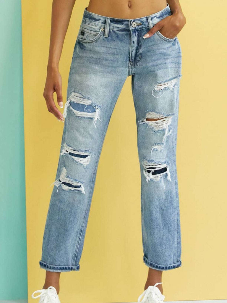 High Waisted ,5 Pocket Single Button Front and zip-fly Jean, with Light Fading and 3d Whisker detail , and moderate destruction with patches on both legs .