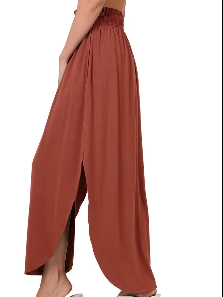 Dark Rust Maxi- Skirt smocking waist band side slit and side pockets with rounded hem-line.