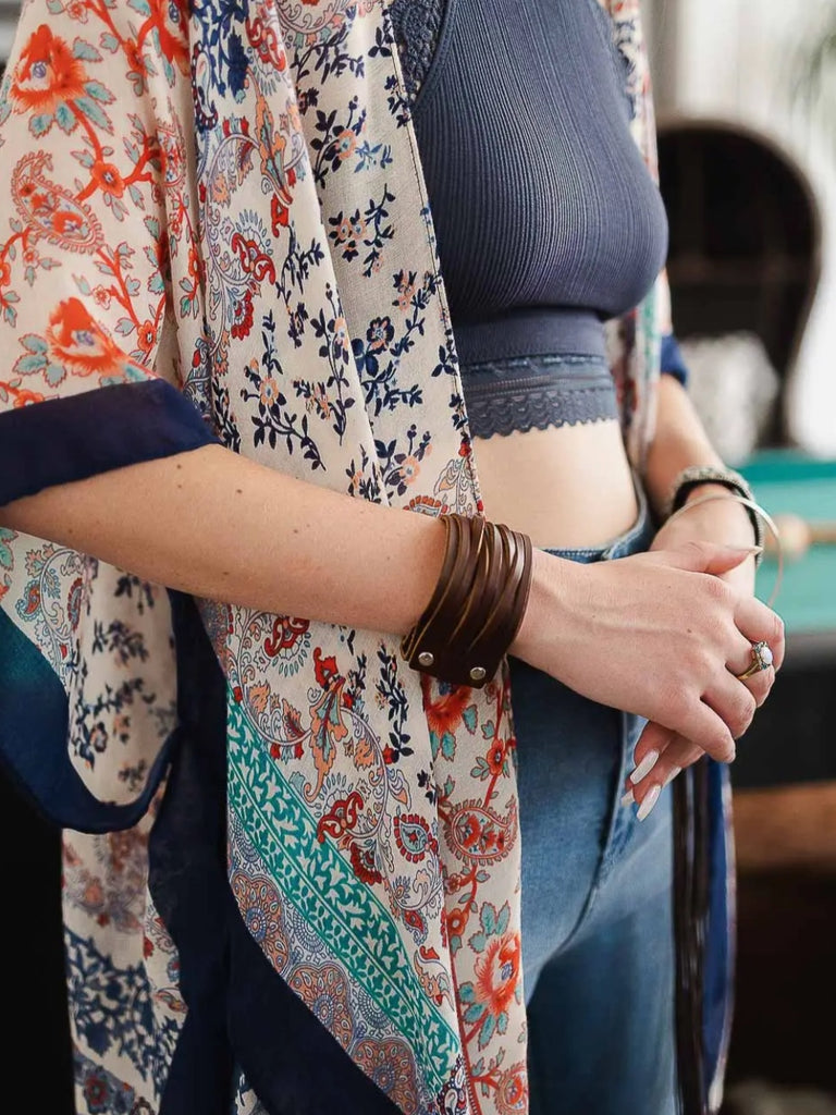 100% Brown  leather, adjustable clasps and a snap close Boho Bracelet.