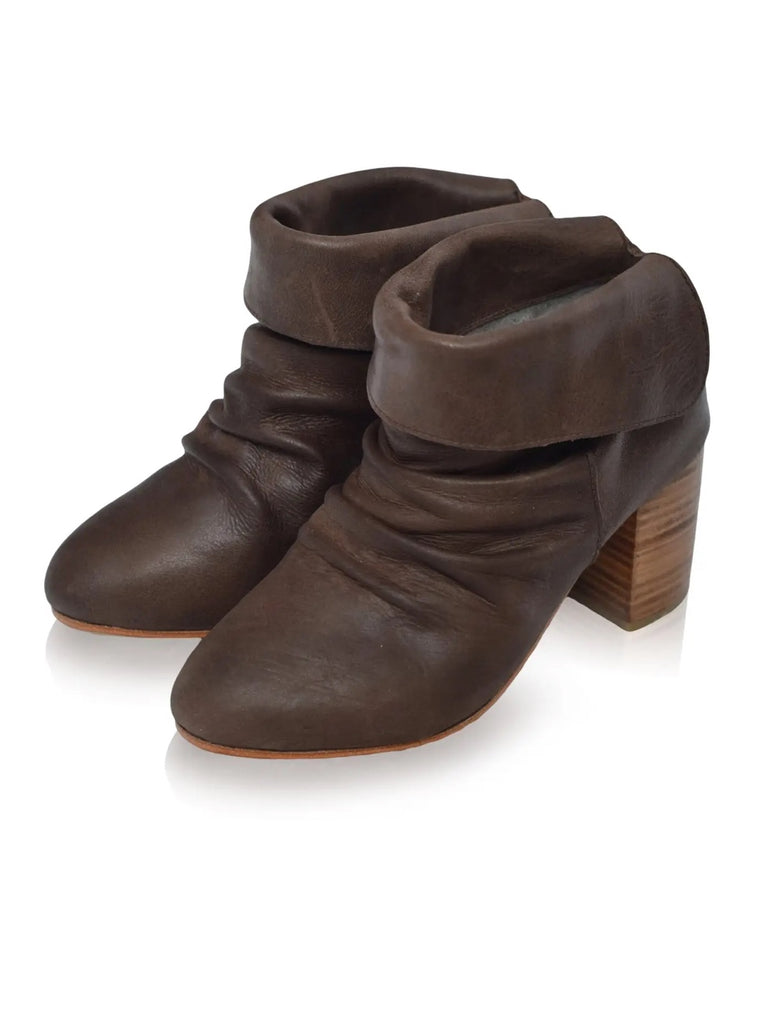 Brown Pull-on style leather boots, featuring versatile fold over option, leather lining and insole, with slightly padded footbed hand cut wooden heel.