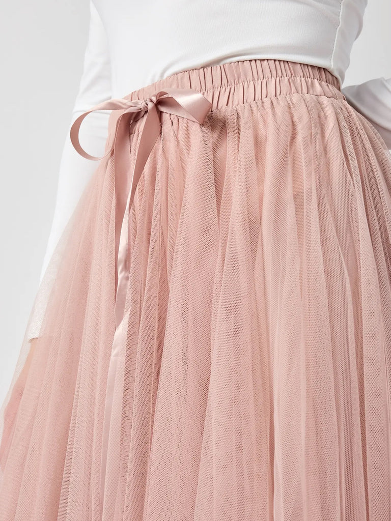 Maxi-length , Pink Tulle ,Tutu Skirt with flattering Flare and Ruffle Details with tie at the front.