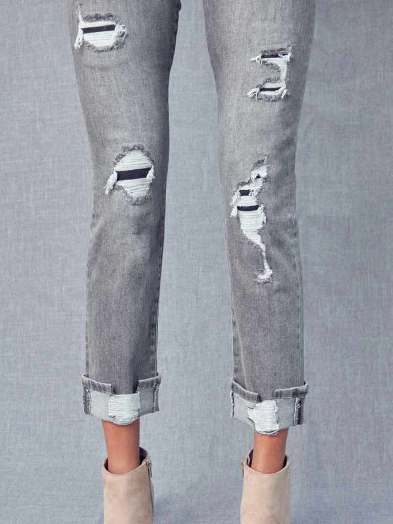 Grey Cropped, straight leg -piece button front closure,  5 pockets denim jeans with tattered details, and a cuffed hem with distress detail.