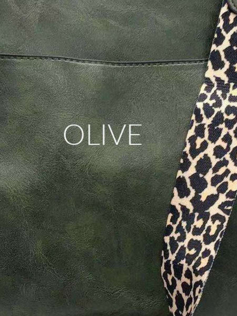 Olive Crossbody bag with leopard print strap. Made with vegan leather, it features a full zipper closure, an exterior back zip pocket, two open slip pockets, and a zipper pocket inside.