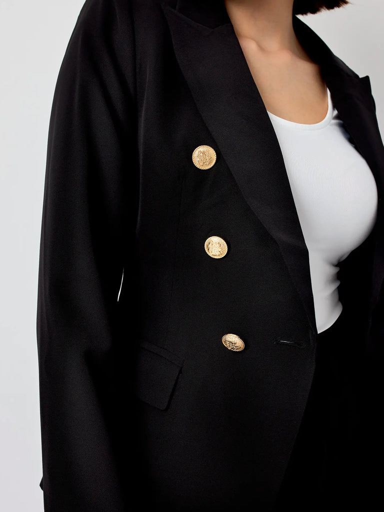 Black Double breasted, fitted Blazer with gold tone buttons, lapel collar, and long sleeves.