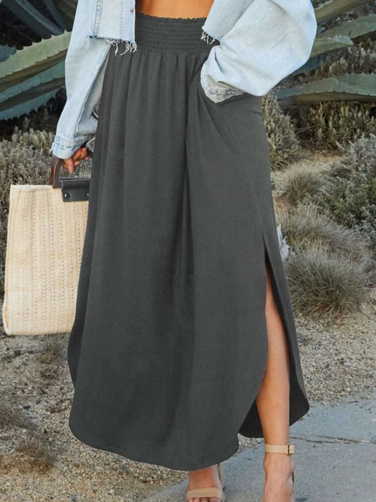 Charcoal Maxi- Skirt smocking waist band side slit and side pockets with rounded hem-line.