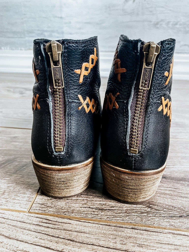 Black leather, ankle bootie with heavy stitching on the upper ,top pattern has an attractive V plunge. Zipper in the back, and a stacked heel measure 1.75 inches.