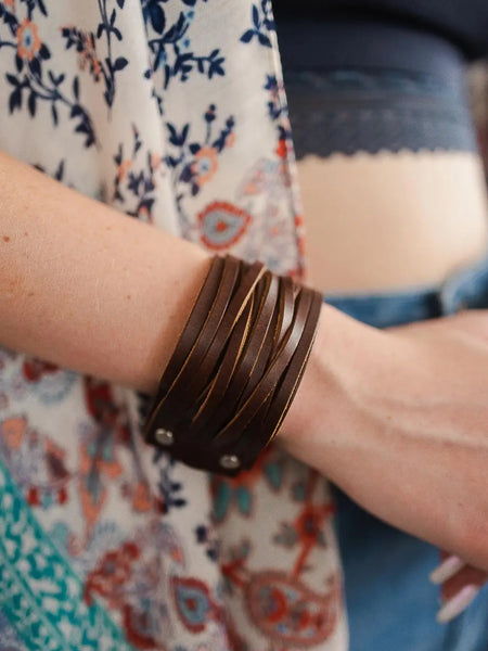 Brown , 100% leather, adjustable clasps and a snap close Boho Bracelet.