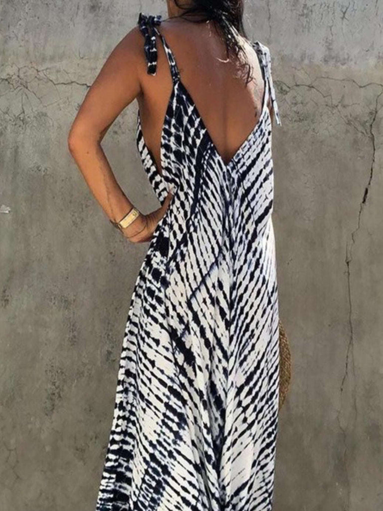 Tie Dye Navy and White Print Wide Leg Jumpsuit in 100% polyester with a deep v- back and Tie Straps.